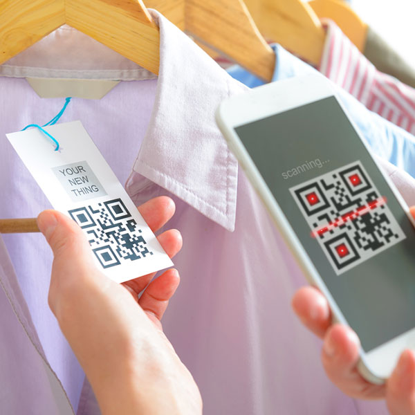 How do QR codes compare with NFC tags